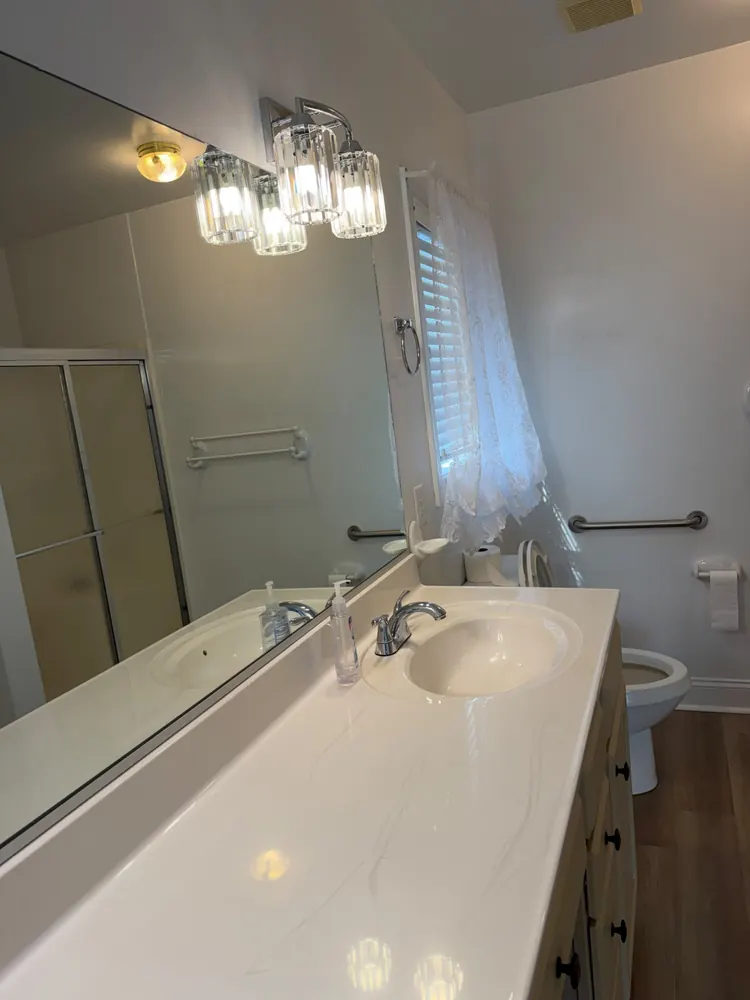 Bathroom vanity, mirror and fixtures wiped clean